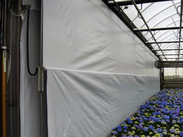 Roll-up side curtain for greenhouse energy-saving